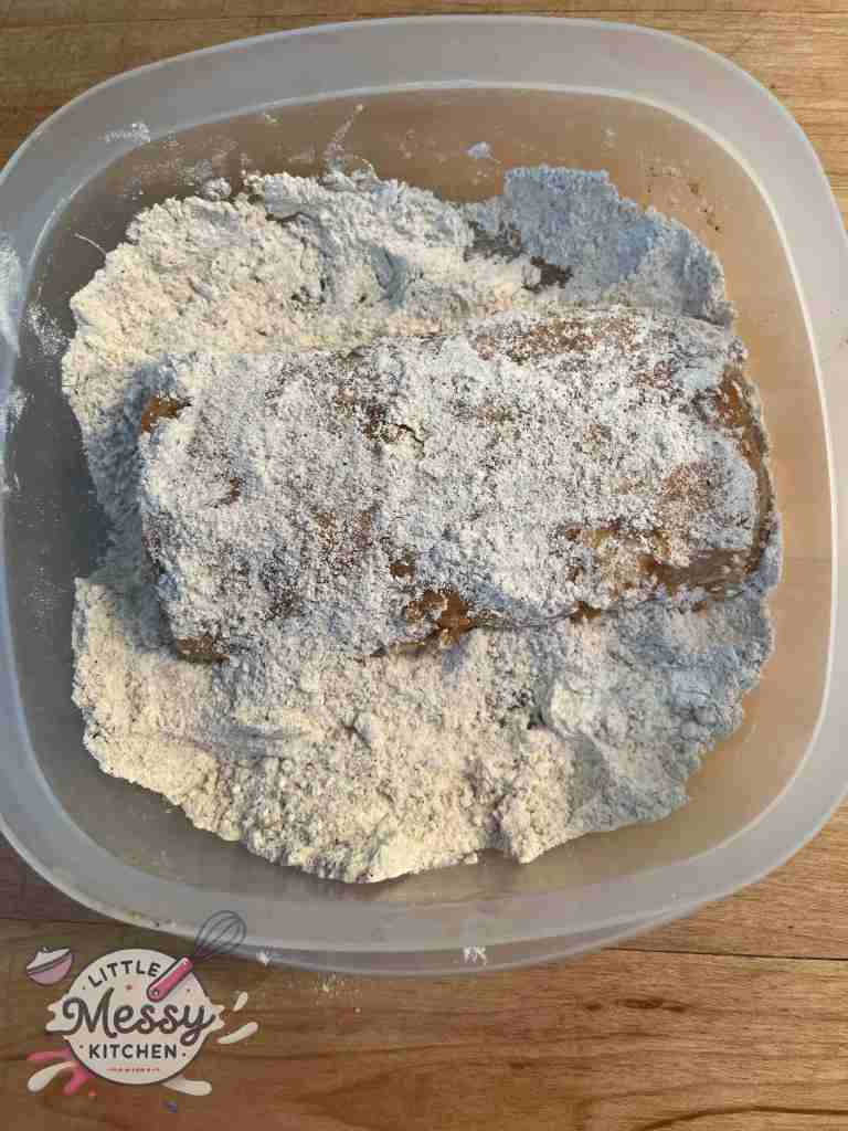 Cod filet in flour mixture.