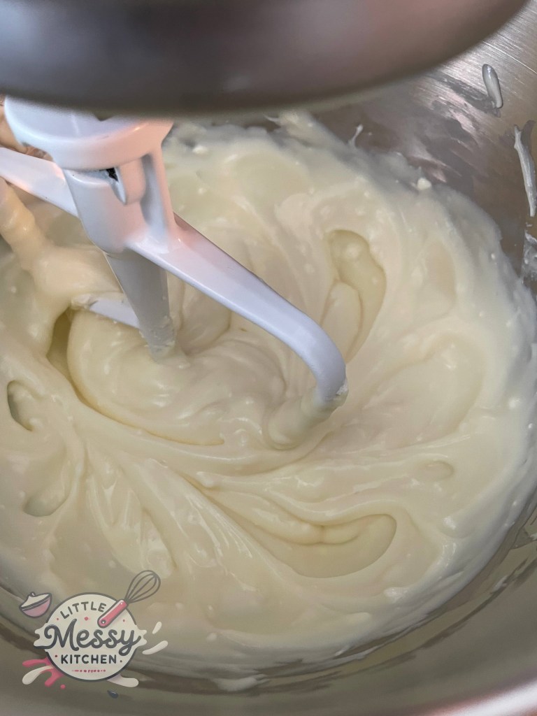 Cream cheese and vanilla pudding mix blended in a stand mixer.