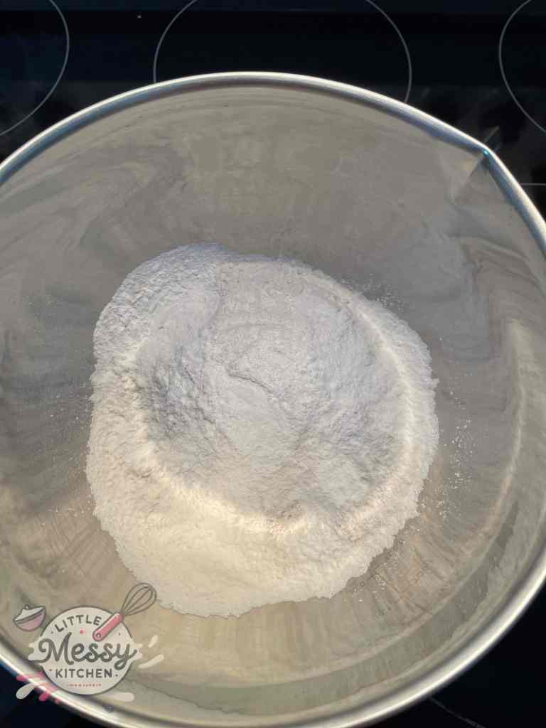 Flour, sugar, salt and baking powder mixed in a bowl