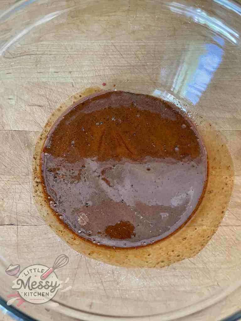 Steak marinade: Soy sauce, oyster sauce, black pepper, baking soda and baking powder in a bowl.