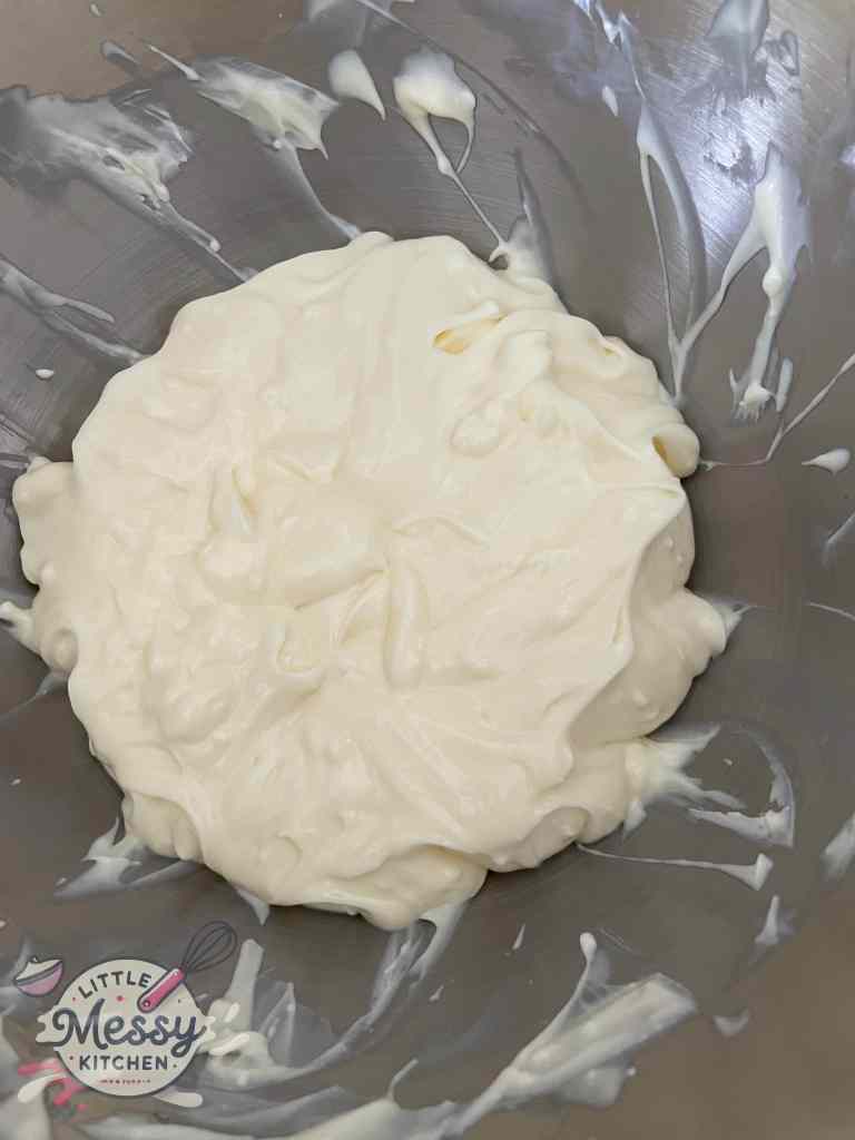 Cream cheese and vanilla pudding combined together in stand mixer.