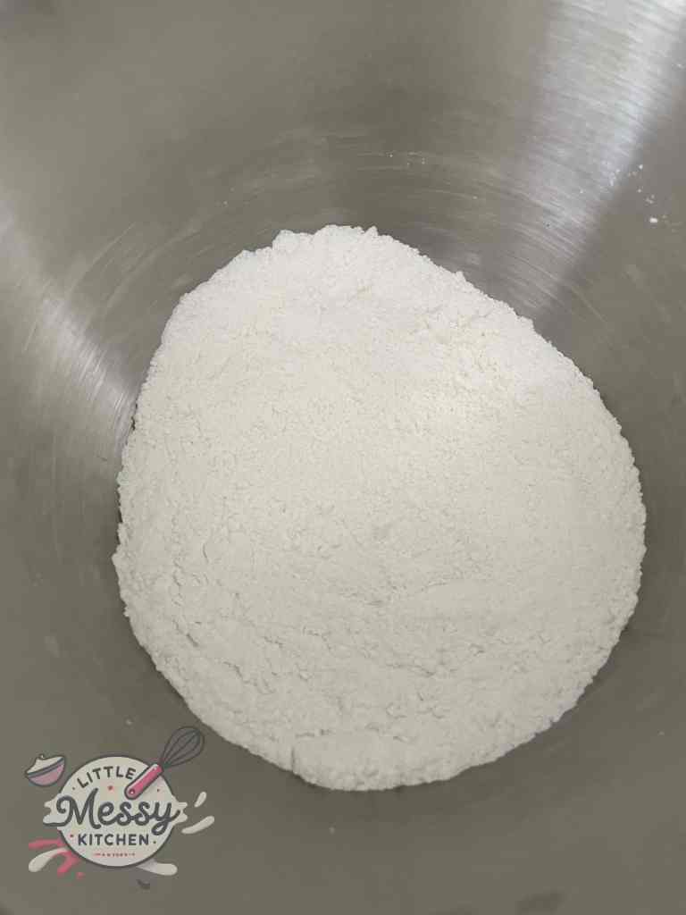 Flour, sugar, baking soda, and salt mixed together in a bowl