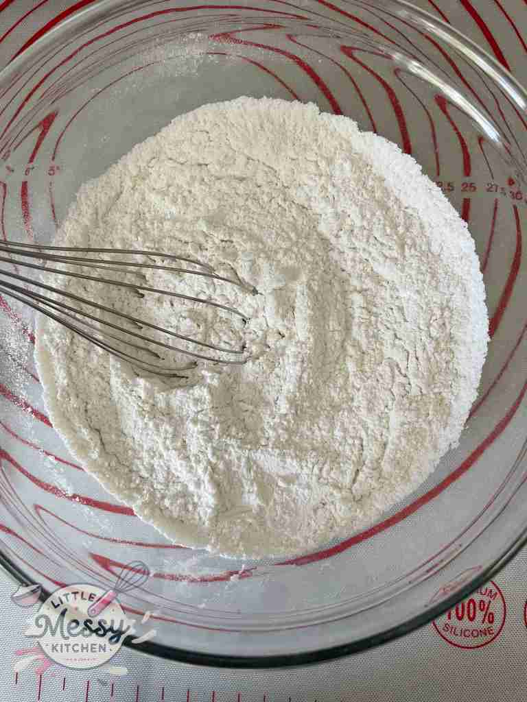 Flour, salt, baking soda, and baking powder in a mixing bowl