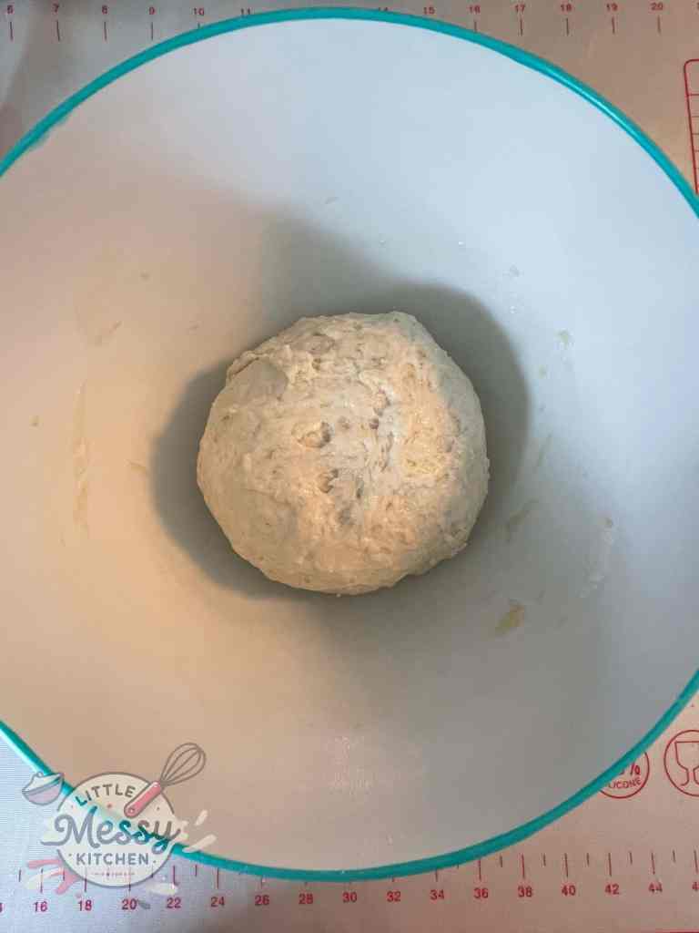 Ball of dough in a bowl, ready for first rise.