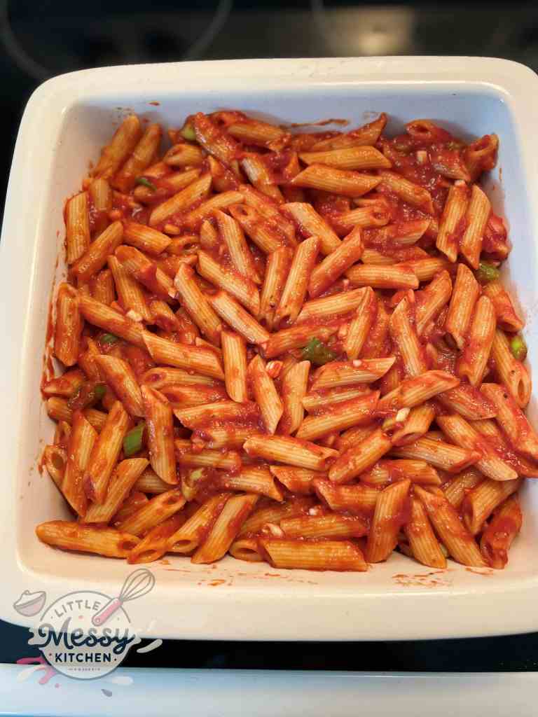 Pasta mix in a baking dish, ready to be baked.