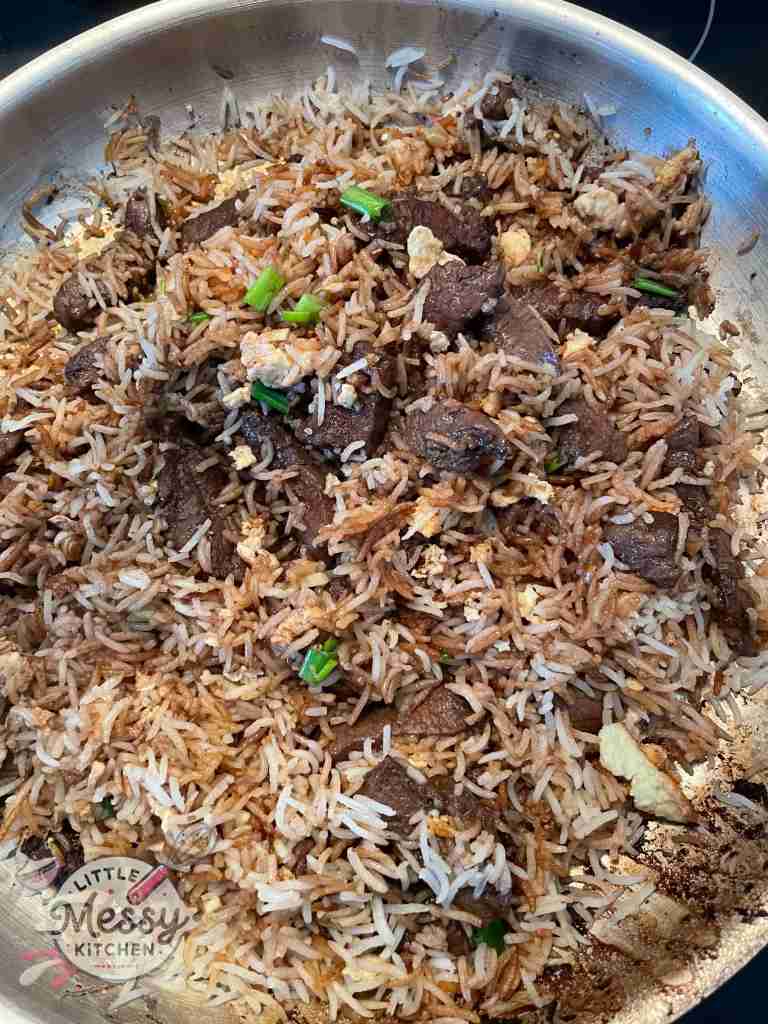 Steak added to frying pan.