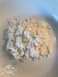 Cooked rice served on a plate.