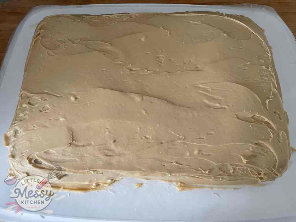 Carrot cake with frosting spread on top