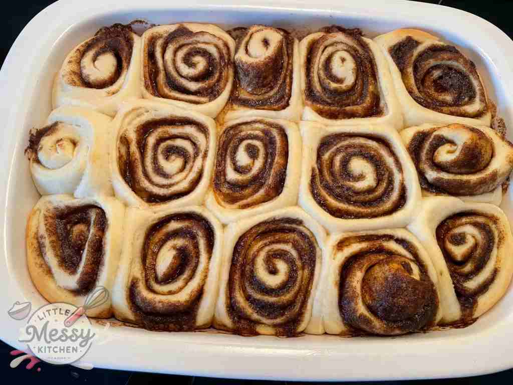 Cinnamon rolls fresh out of the oven in baking dish.