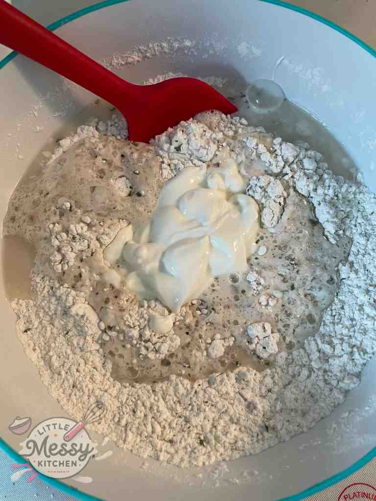 Yeast mixture and yogurt added to the flour mix.