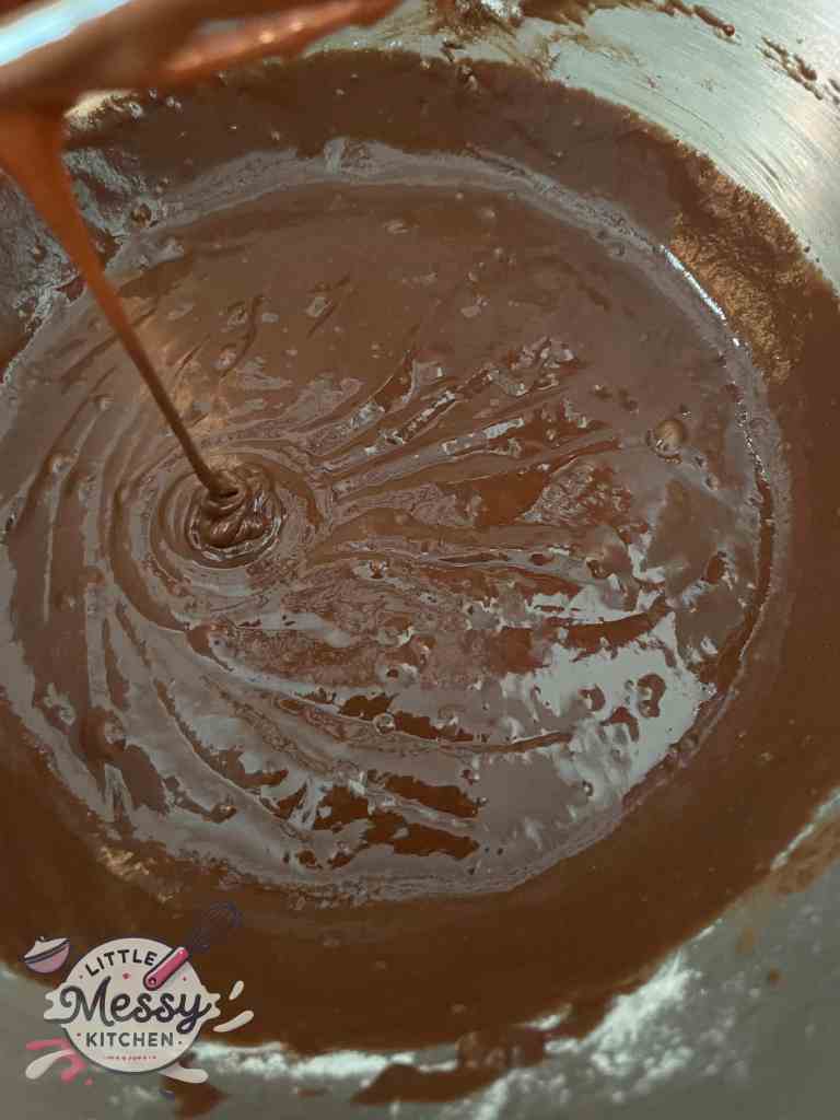 chocolate mixture and flour mixture combined in a bowl.