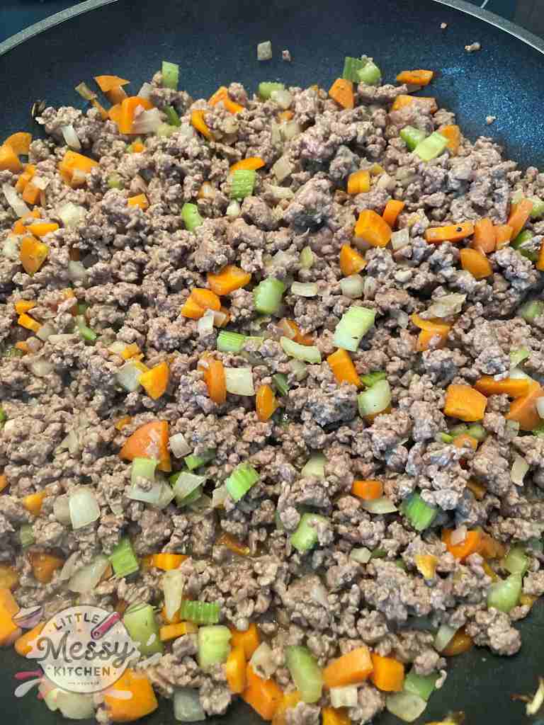 Ground Beef added to the skillet.