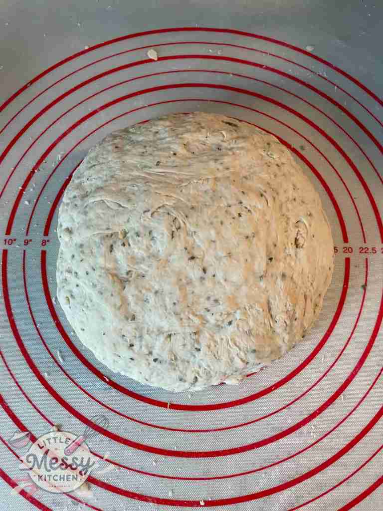 Ball of dough on pastry mat.