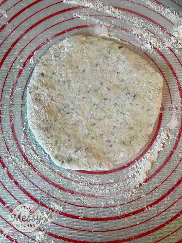 Dough shaped in 7" disk on pastry mat.