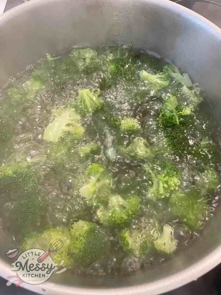 Broccoli in a boiling pot of water.