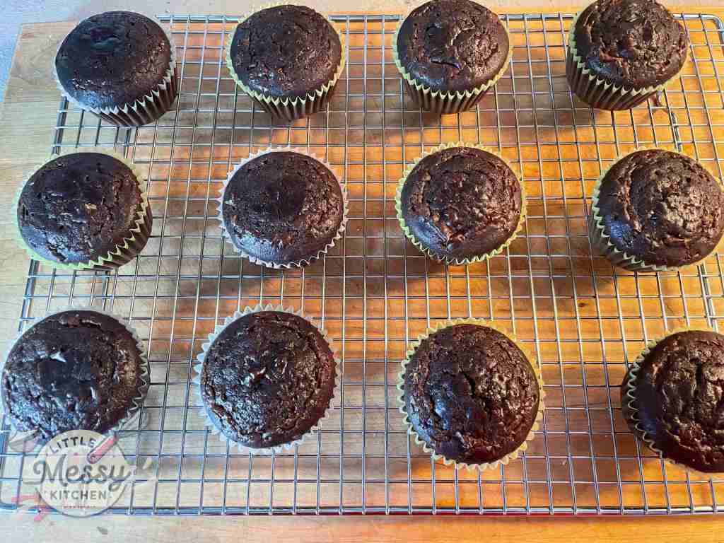 Baked Chocolate cupcakes on a cooling rack.