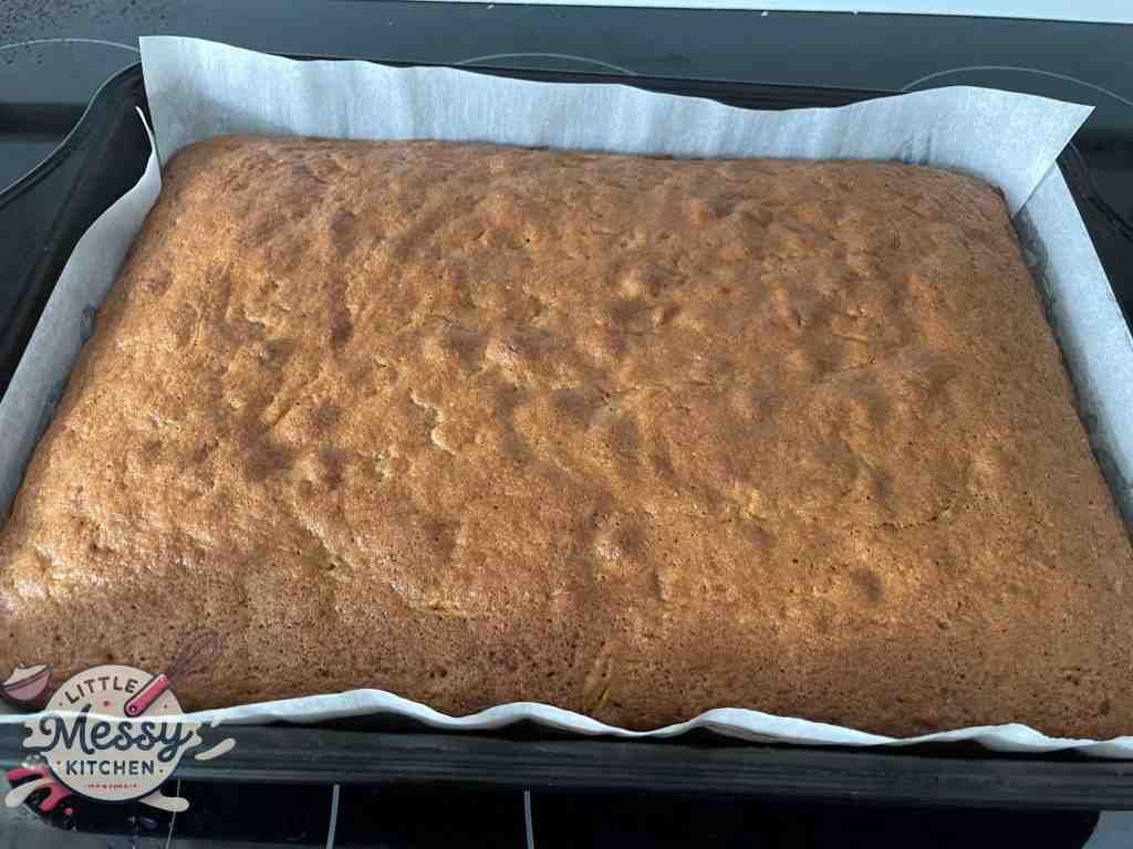 Baked carrot cake in a baking pan.