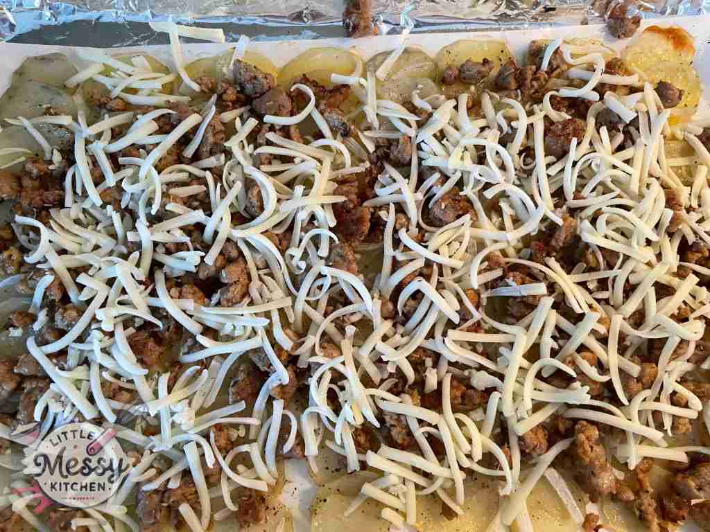 Cheesy Italian Sausage Potato Bake on a baking sheet.