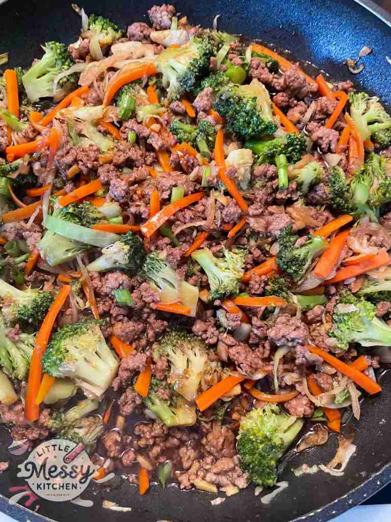 Stir Fry sauce added to the skillet.