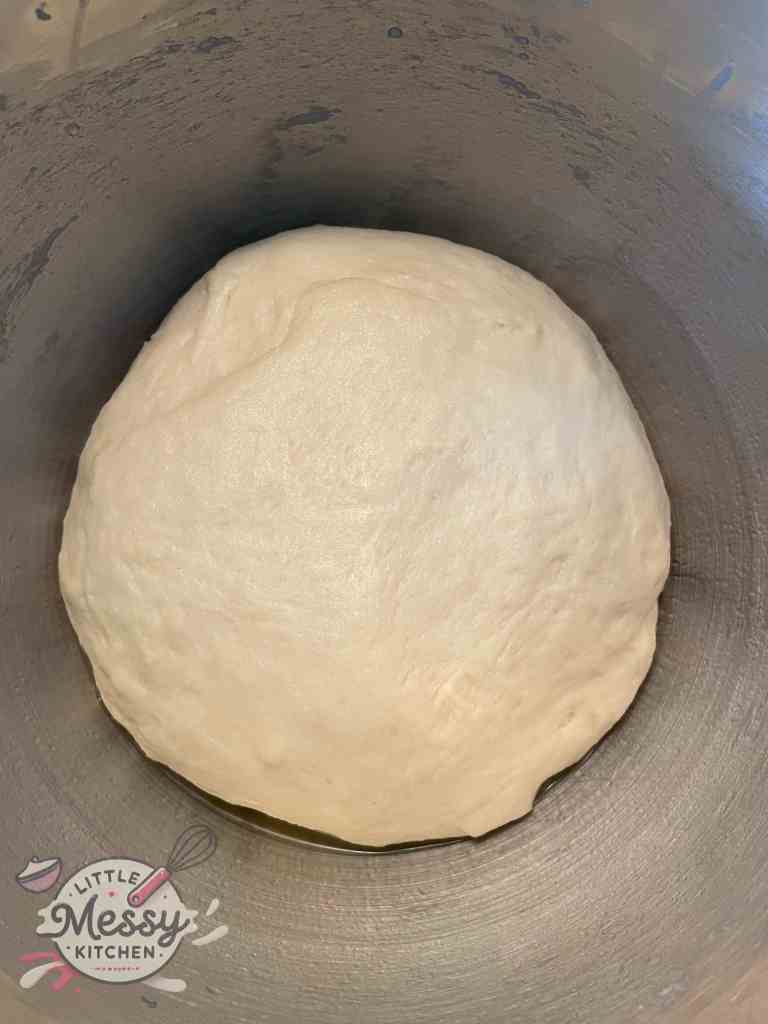 Cinnamon rolls dough after first rise.