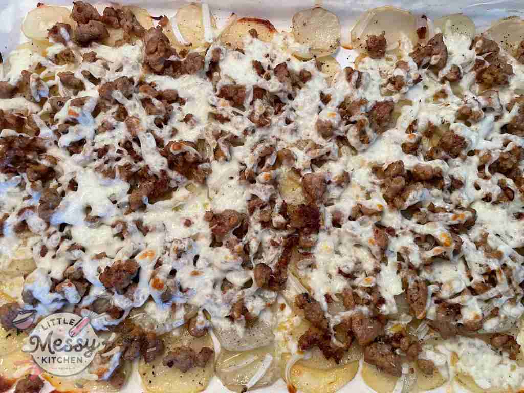 Cheesy Italian Sausage Potato Bake on a baking sheet out of the oven.