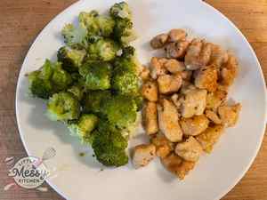 Serving of Honey garlic chicken in a plate served with steamed broccoli.