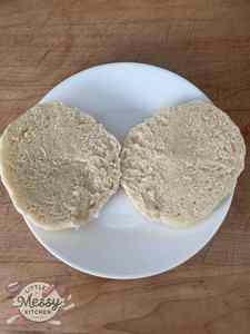 English Muffin sliced in half in a plate.