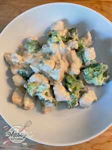 Creamy chicken broccoli skillet served in a white bowl.