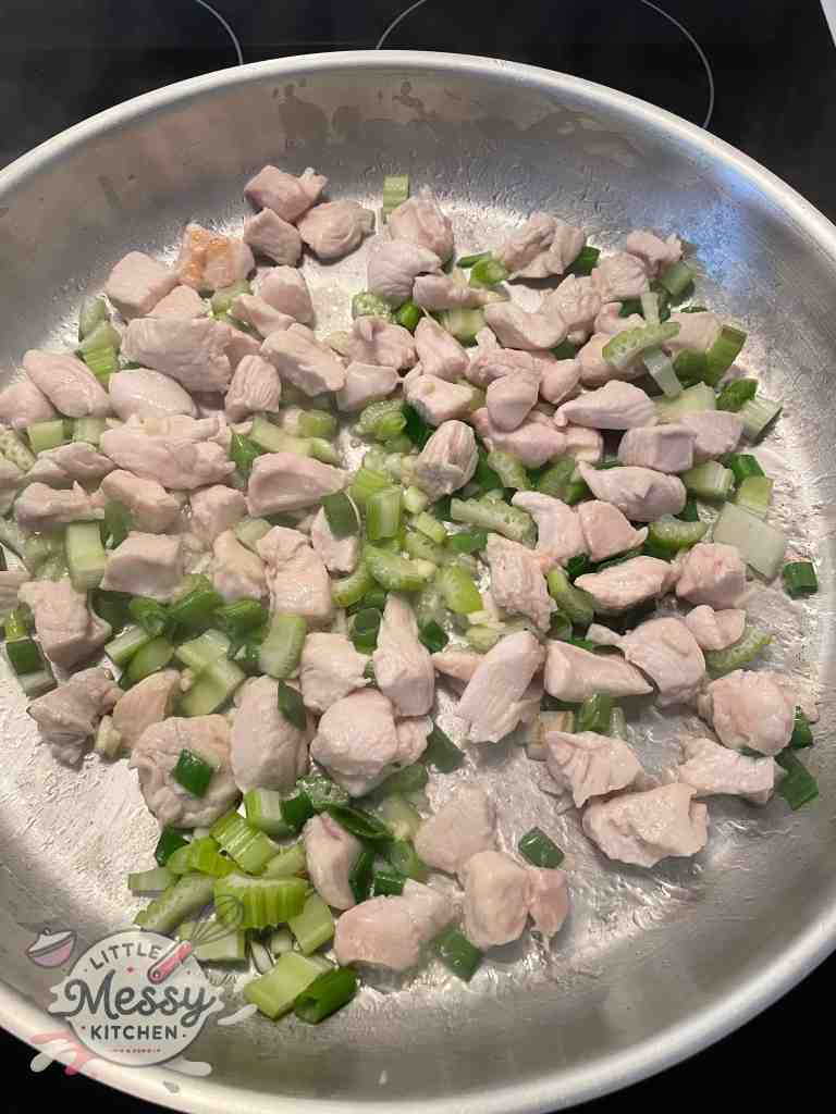 Vegetables added to the frying pan. 