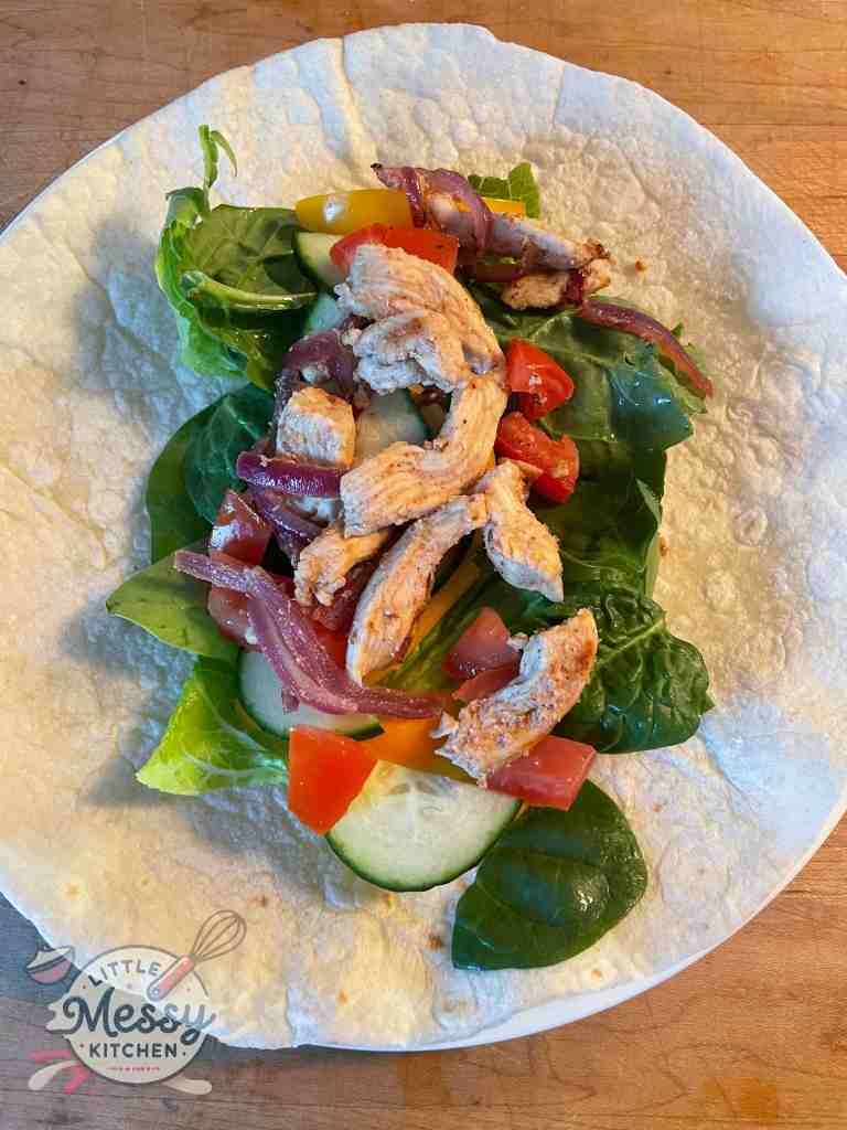 Chili-Lime Chicken Wrap served in a plate.