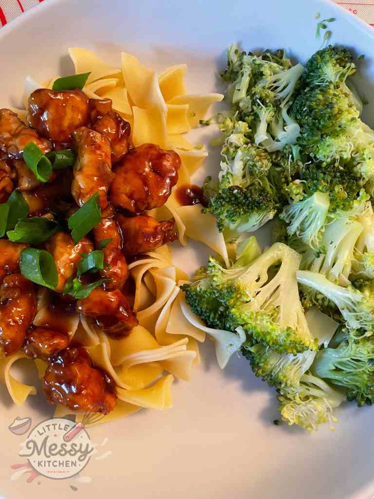 Serving of Sweet and Sticky Sesame Chicken in a white bowl.