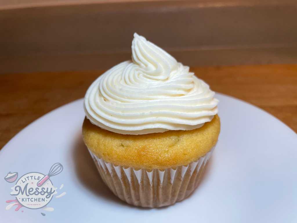 Frosted cupcake in a white plate.