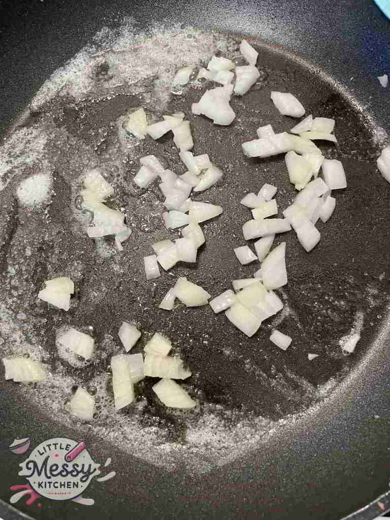 Onions sauté in a skillet