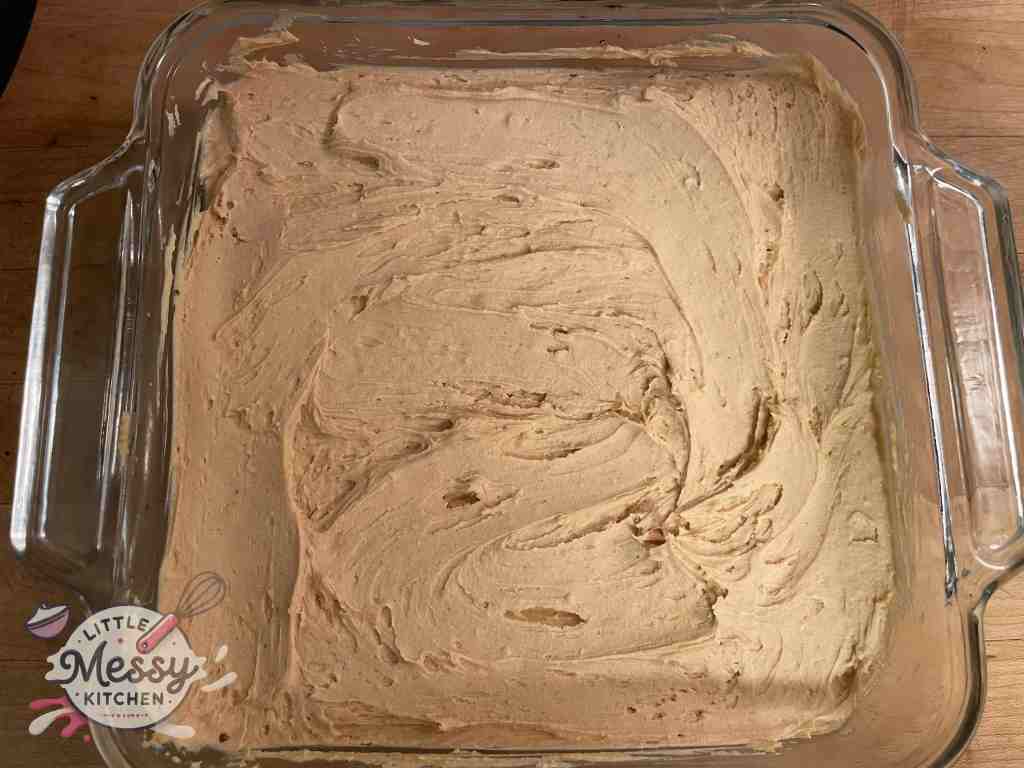 Peanut butter layer spread on brownie layer.