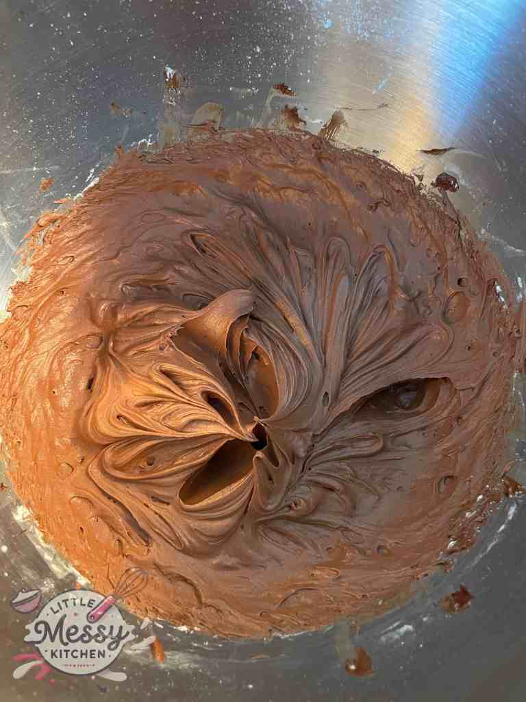 Ganache Frosting in a stand mixer.