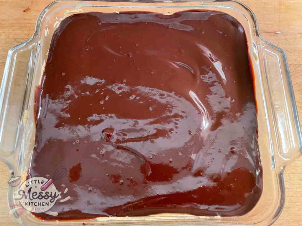 Chocolate layer poured on top of dish.
