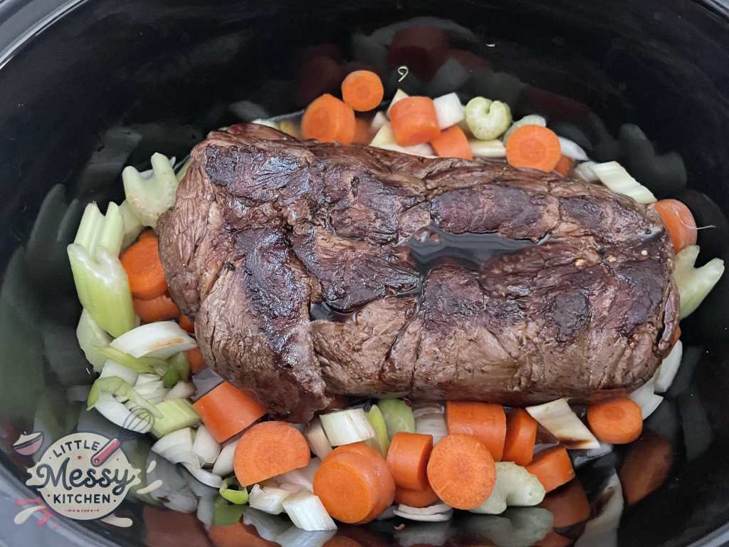 Chuck Roast added in the slow cooker.