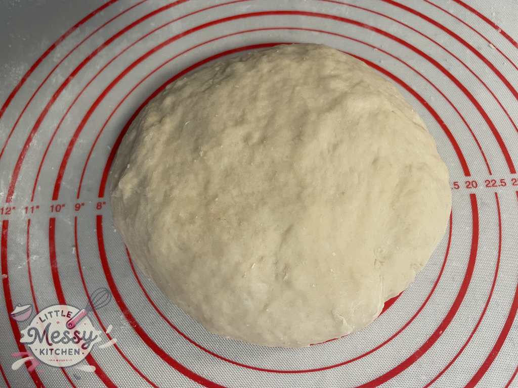 Dough formed on a pastry mat.