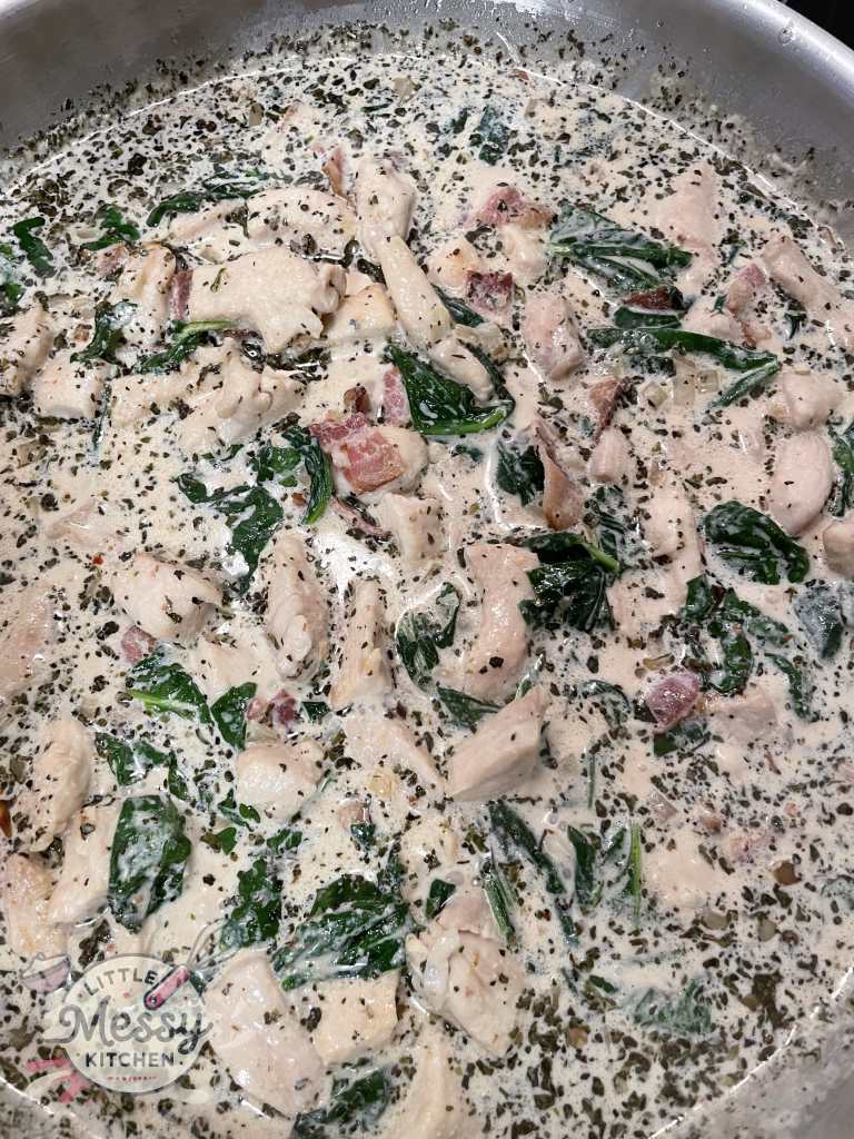 Spinach, Bacon and chicken added to the skillet.
