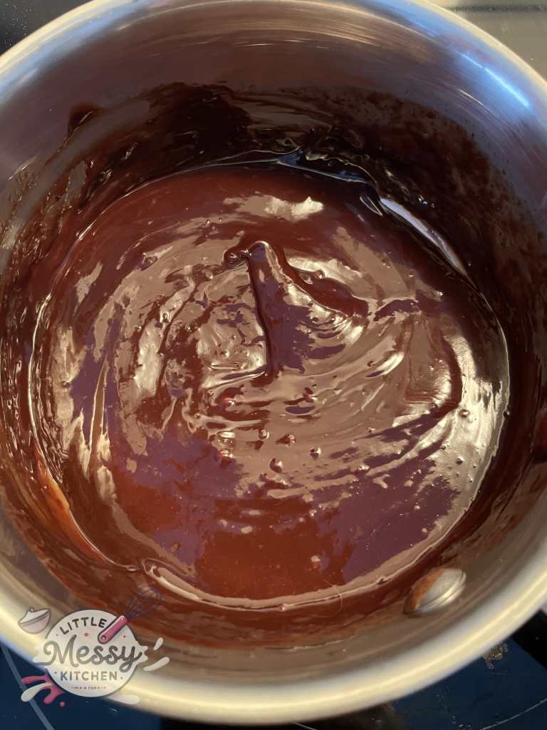 Chocolate ganache in saucepan.