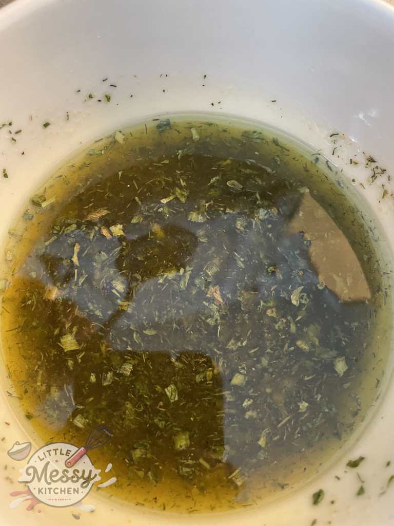 Olive oil, ranch seasoning and apple cider vinegar in a mixing bowl