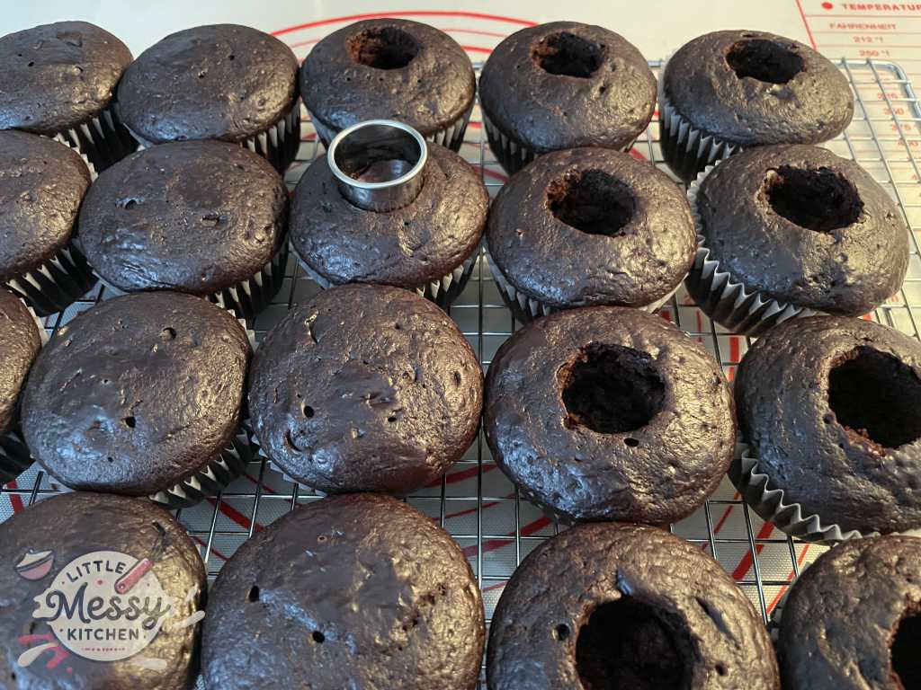 Center of cupcakes removed for raspberry filling.