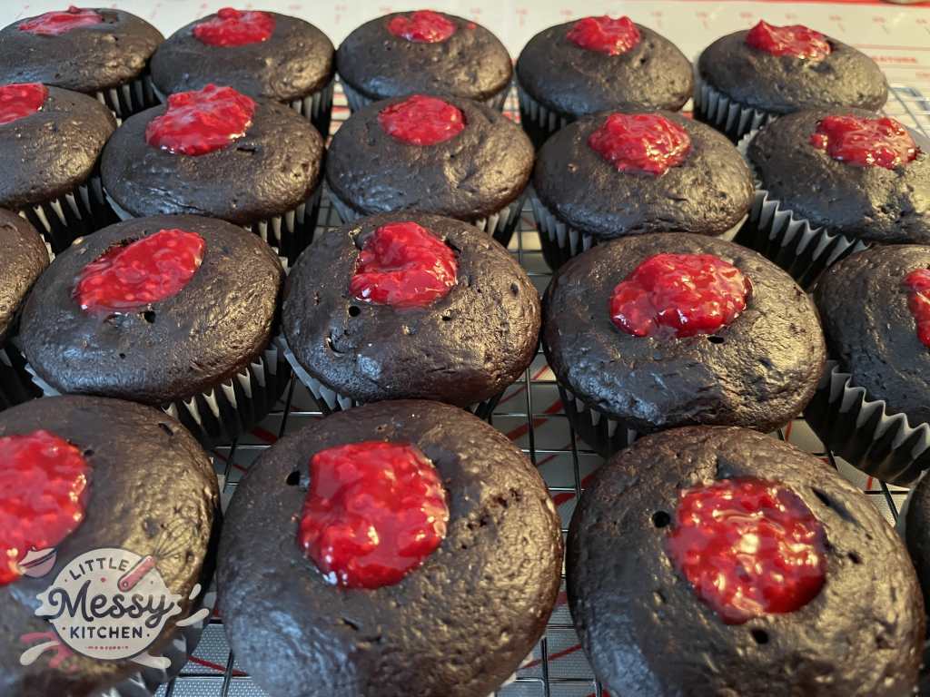 Raspberry filling filled in the cupcakes.