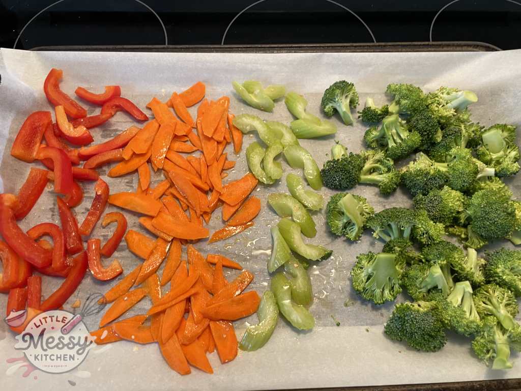 Vegetables lined on baking sheet.