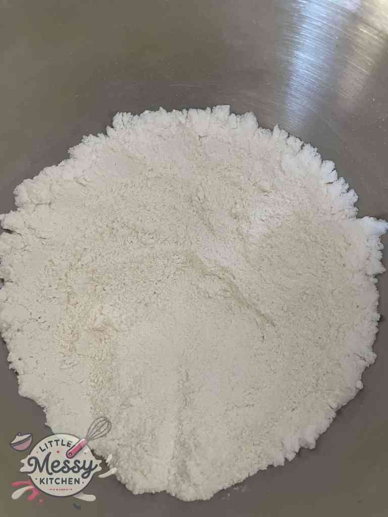 sugar, flour, vanilla pudding mix, baking powder, baking soda, and a pinch of salt combined in mixing bowl.