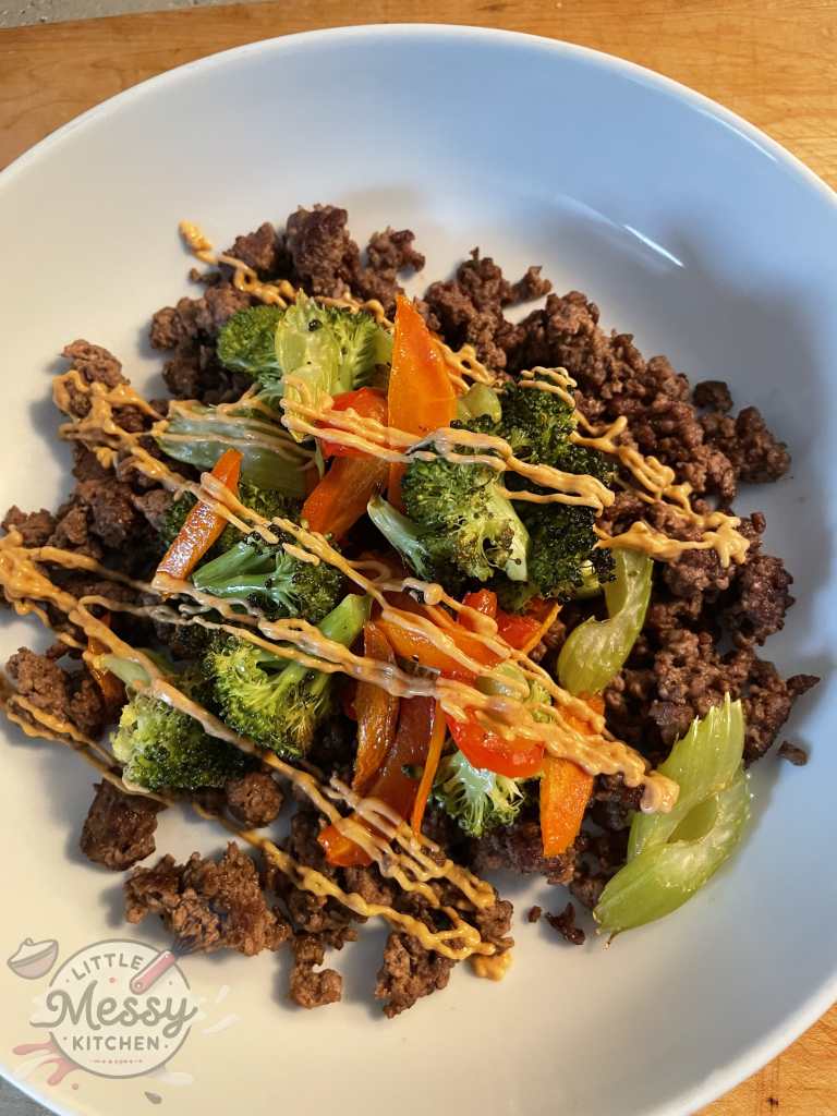Ground Beef and Roasted Veggie Bowl served in white bowl.