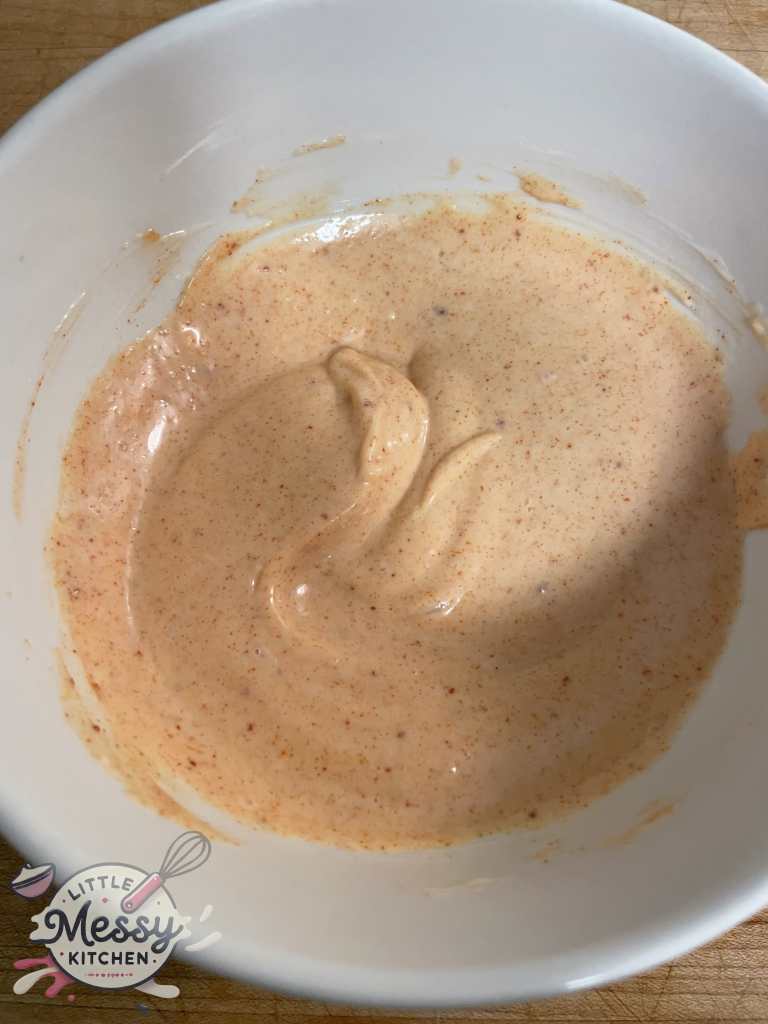 Ingredients for the sauce mixed in bowl.