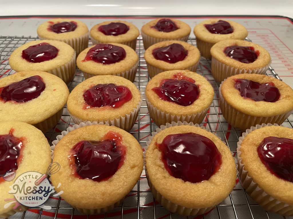 Strawberry filling spooned in the cupcakes.